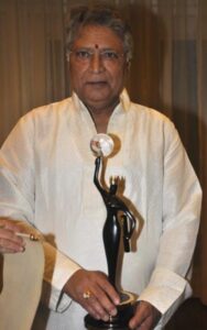 Vikram Gokhale posing with his Lifetime Achievement Award at the 4th NBC Awards
