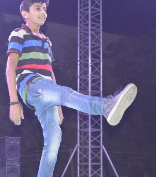 A childhood image of Chirag Katrecha while performing at a school annual function
