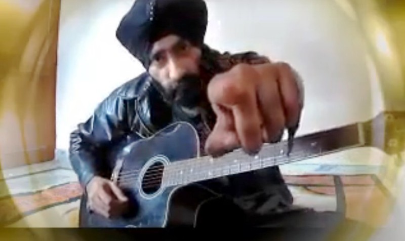A photo of Paramjeet Singh taken when he was playing the guitar