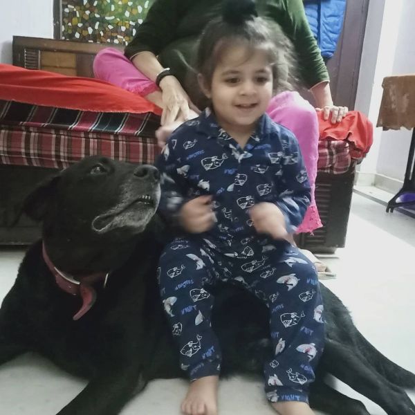 A picture of Paramjit Singh's son and his pet
