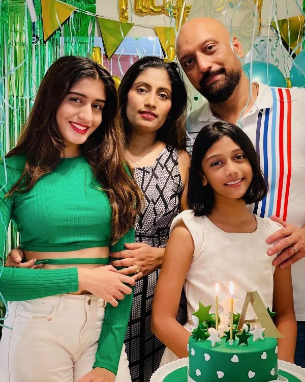Aadhya Anand (left) with her family