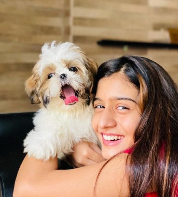 Aadhya Anand posing along with her pet dog Sky