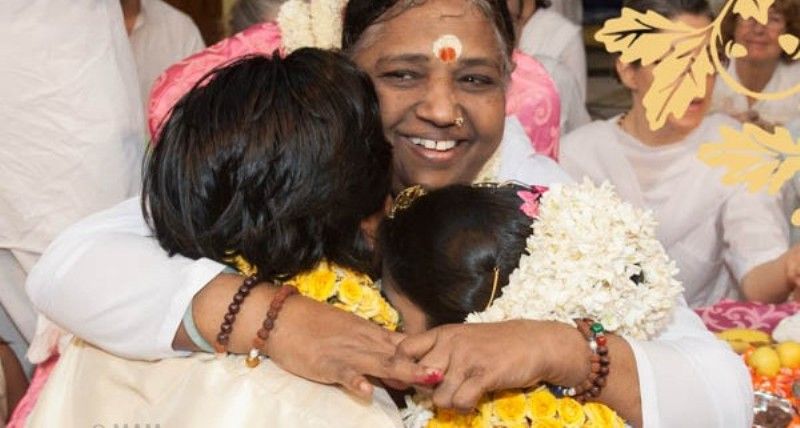 Amma hugging and blessing her devotees