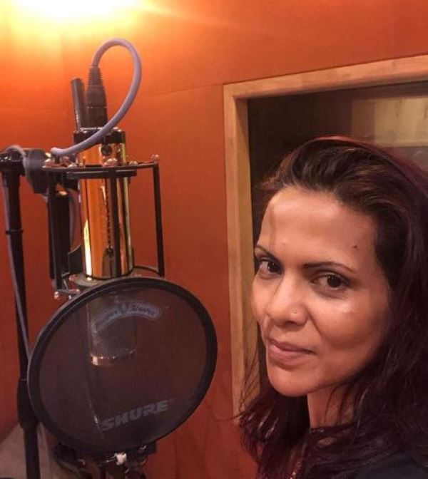 Caralisa Monteiro recording a song in a music studio