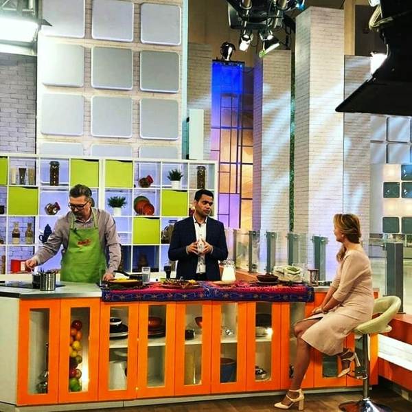 Dr Vivek Joshi talking about the benefits of turmeric in milk during a TV show in Russia