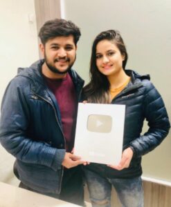 Namra Qadir and her husband Virat Beniwal, posing with their YouTube Silver Play Button