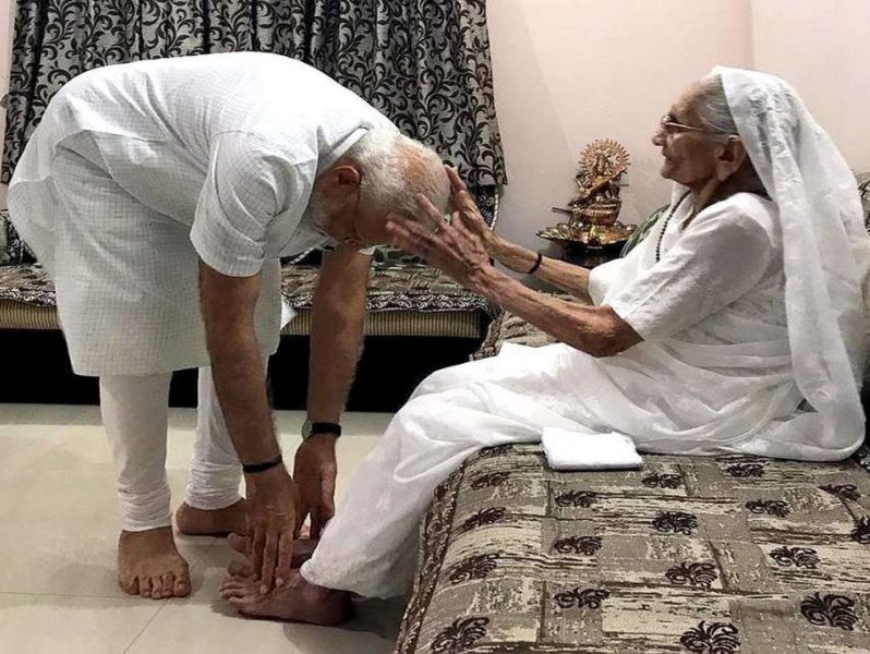 Narendra Modi touching the feet of her mother for blessings