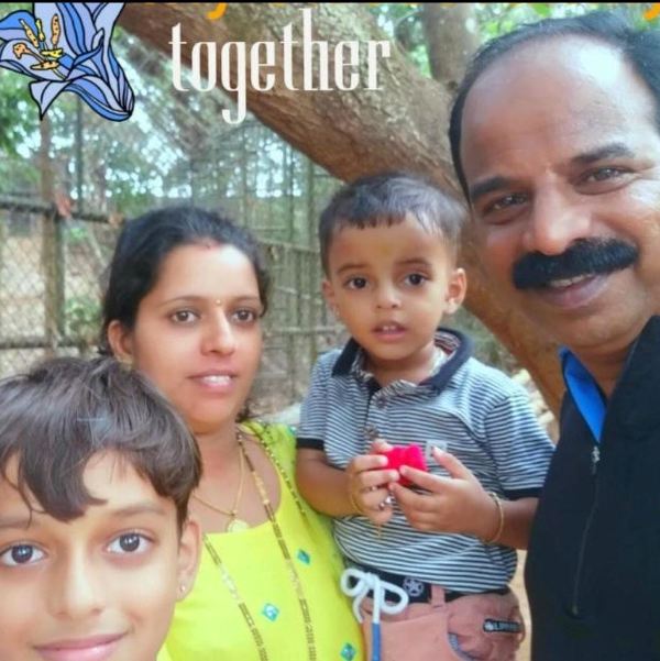 Prakash Thuminad with his wife and children