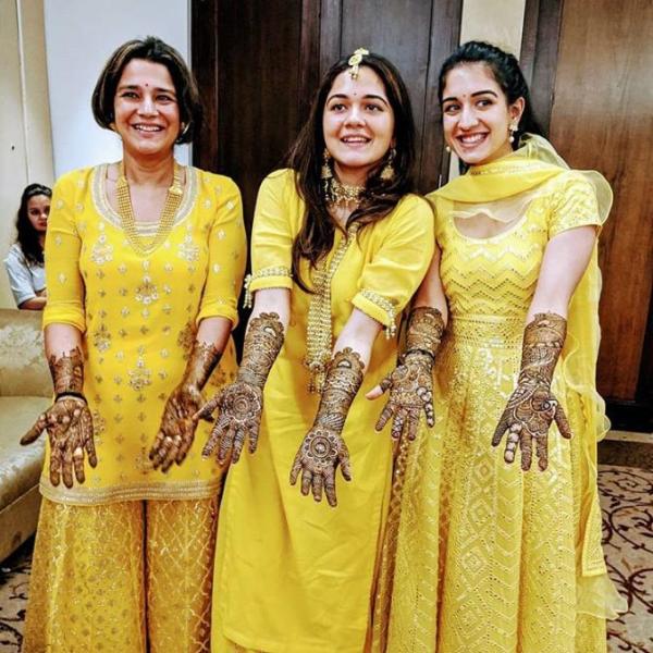 Shaila Merchant with her daughters, Anjali Merchant (middle) and Radhika Merchant (right)