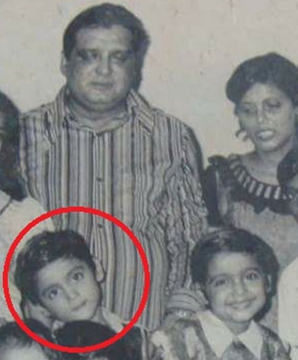 A childhood picture of Ashwin Kaushal with his parents and sister
