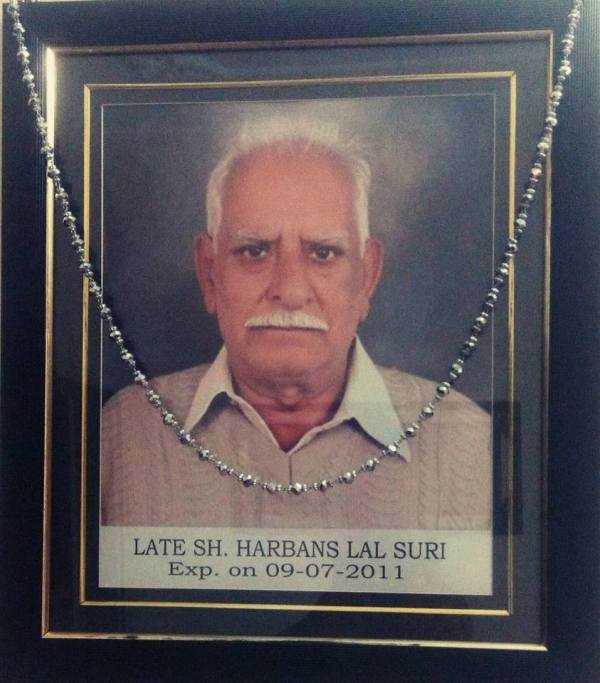 A framed photo of Sudhir Suri's father, Harbans Lal Suri