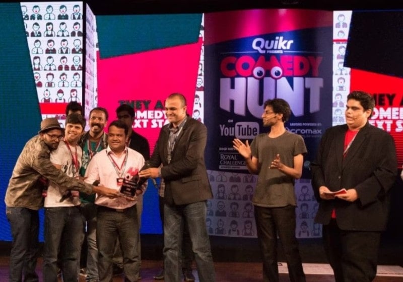 A photo of Kumar and Rahul taken while receiving the award for winning OML Comedy Hunt
