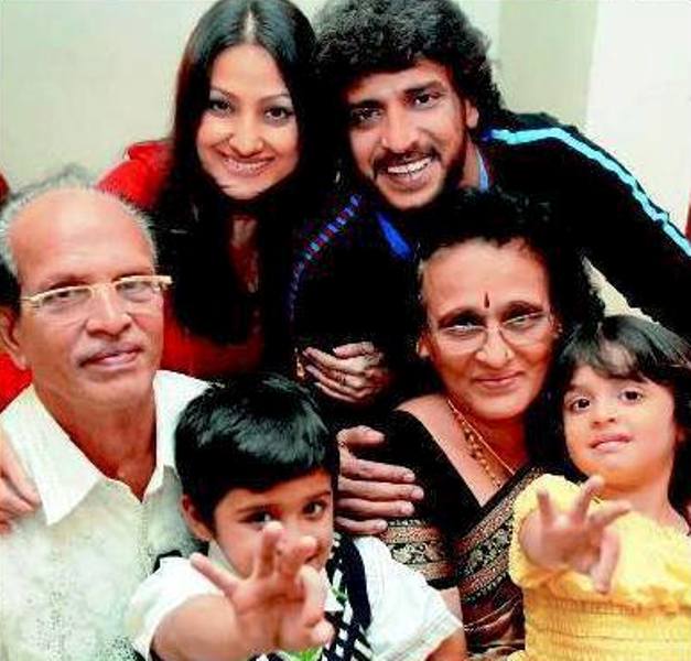 A picture of Upendra Rao with his parents, wife, and children
