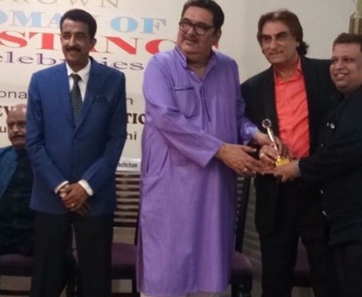 Ali Khan (right) recieving AIAC awards