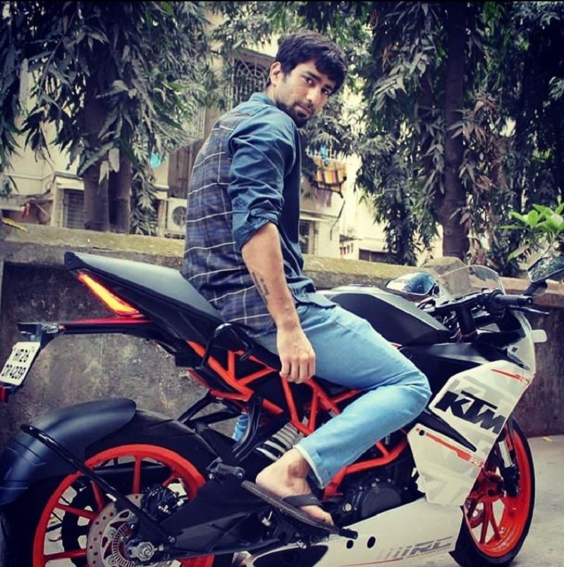 Ambrish Verma posing on his bike