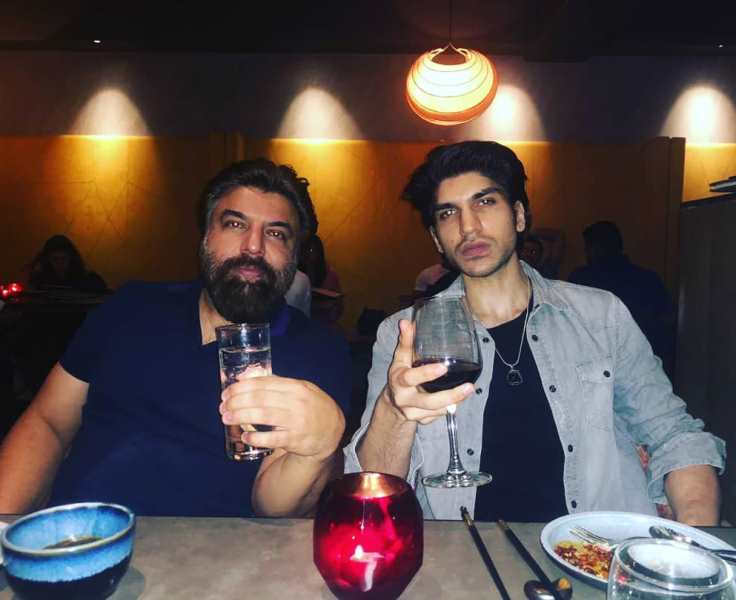 Karan Mehta drinking wine with his father