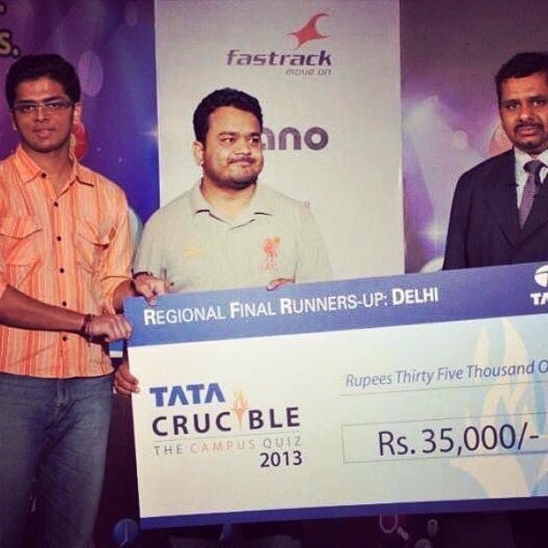 Kumar Varun receiving a runner-up cheque from Tata