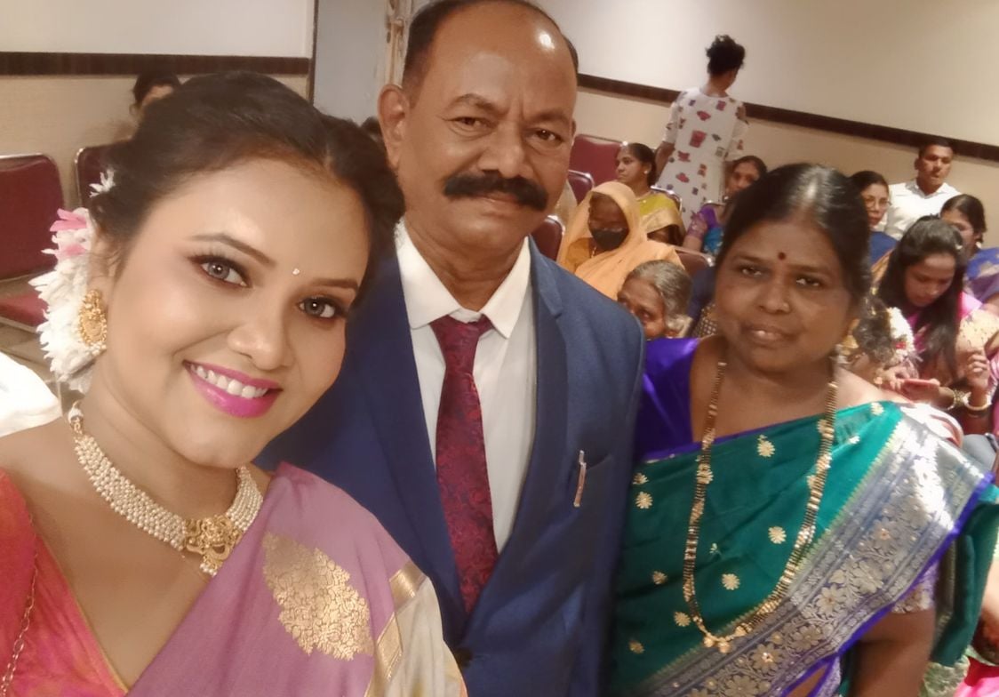 Priya with her parents