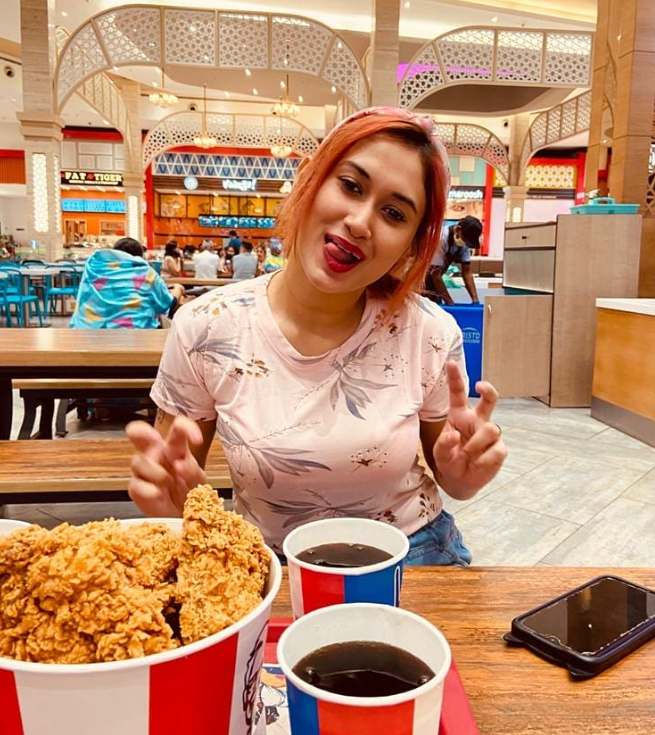 Priyanka Biswas eating chicken at KFC