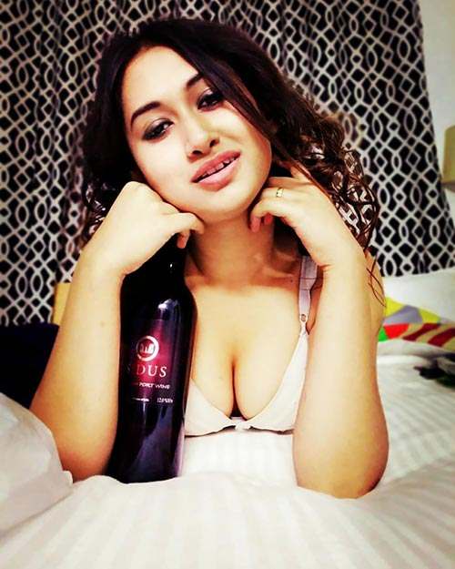 Priyanka with a bottle of wine