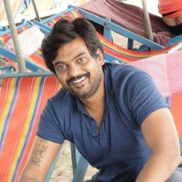 Puri Jagannadh's tattoo on his right bicep