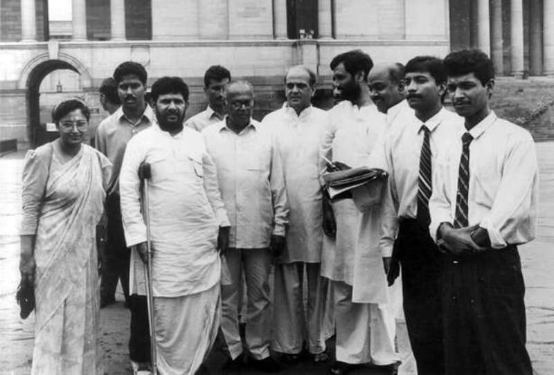 Sharad Yadav (standing with a crutch) with his supporters outside the parliament after submitting a memorandum for OBC reservation