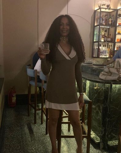 Shweta Shetty holding a glass of alcohol