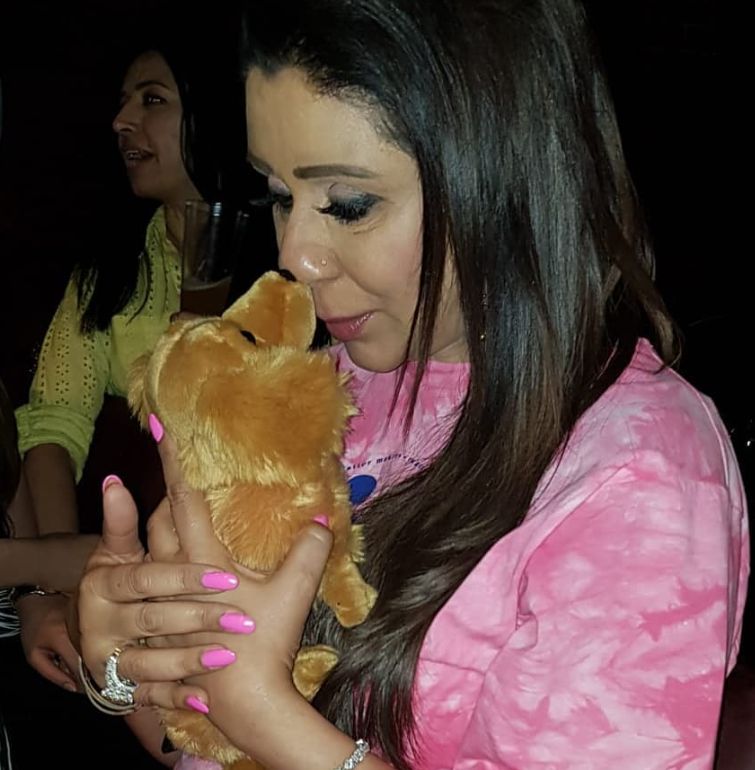 Vandana Luthra expressing her love for animals symbolically with a soft toy