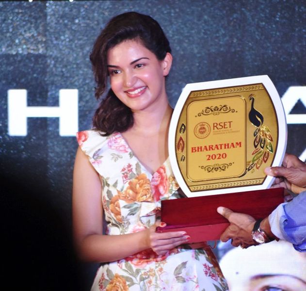 A photo of Honey Rose taken with her Bharatham Award