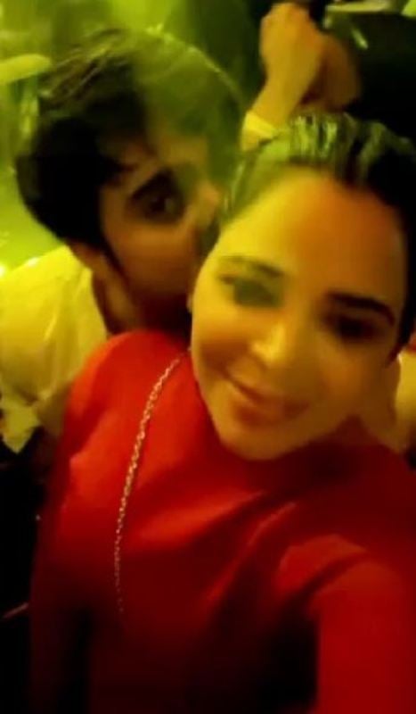 A screenshot from a video of Adil Khan Durrani and Tanu Chandel while clubbing