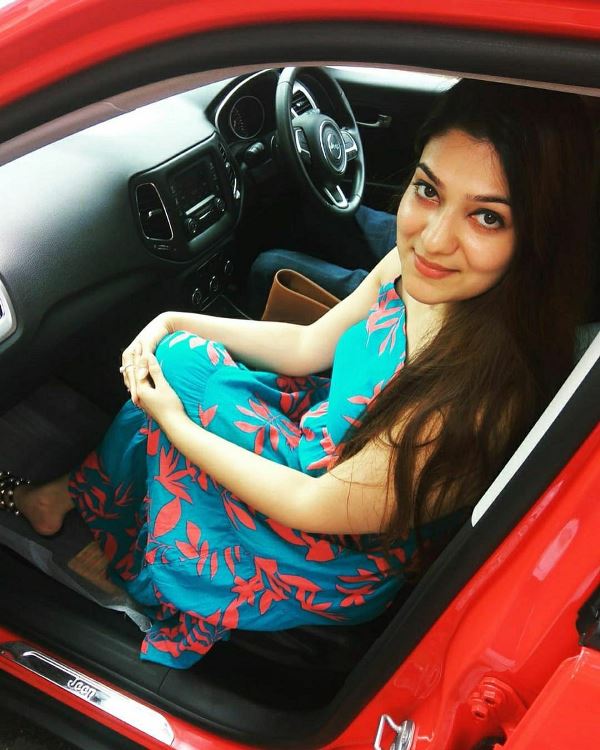 Aditi Gautam sitting in her car