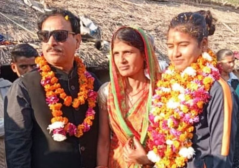 Archana Devi at her village, with her mother and coach