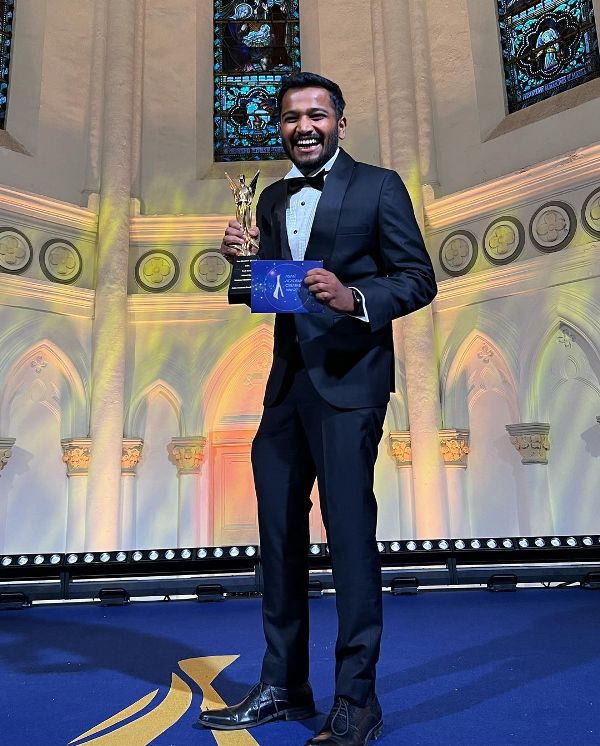 Basil Joseph with the Best Director trophy at the Asian Academy Awards 2022