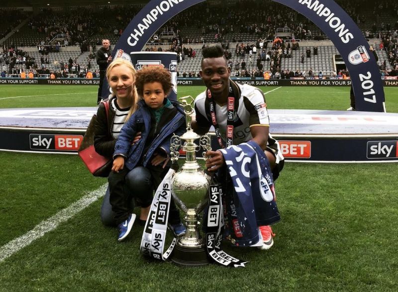 Christian Atsu and his family with the Trophy after Newcastle United qualified for English Premier League (EPL)