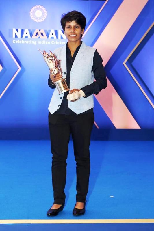 Cricketer Poonam Yadav posing with their BCCI Award (2020)