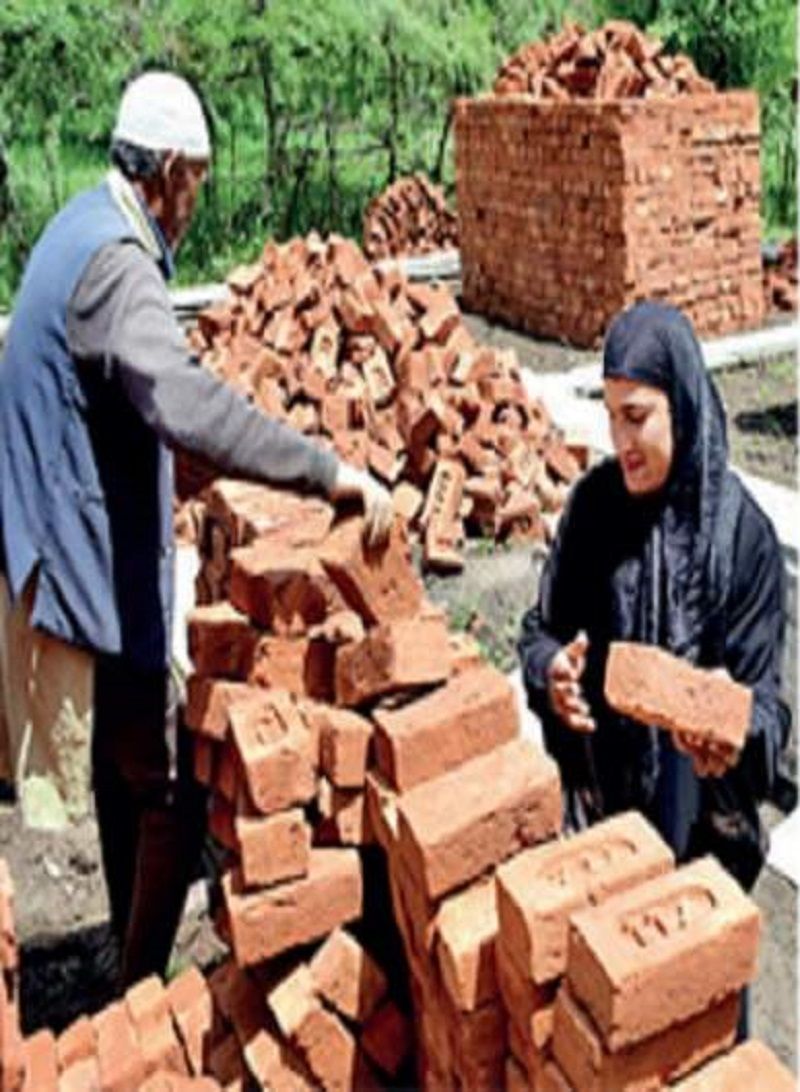 Jasia Akhtar helping her father to make their house