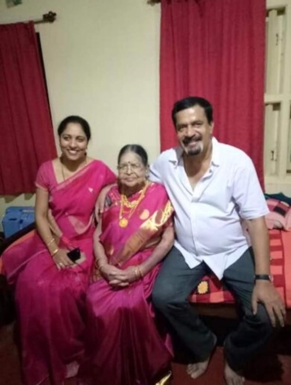 Muthappa Rai sitting with his mother