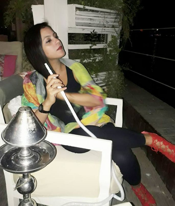 Noor smoking a hukka