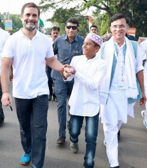 Pawan Khera (extreme right) with the Indian politician Rahul Gandhi during the Bharat Jodo Yatra in Kerala
