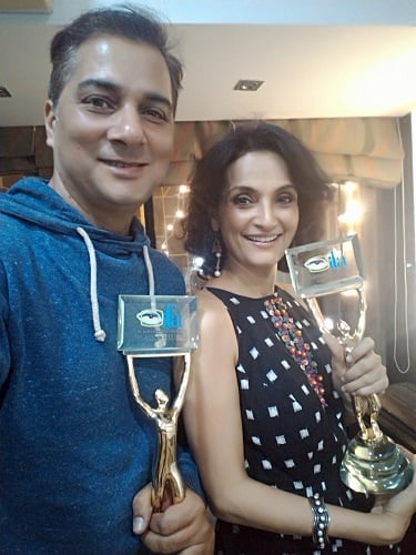 Rajeshwari Sachdev and her husband with their awards