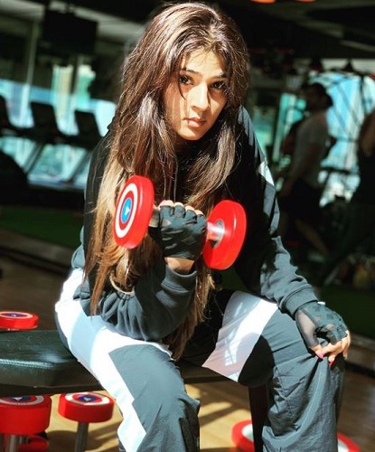 Sapna Gill working out at a gym