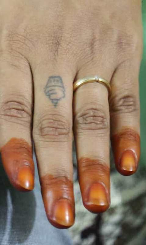 Sneha Deepthi's tattoo on her left hand's middle finger