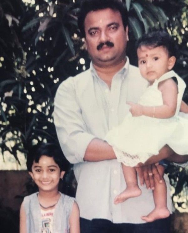 A childhood image of Namitha Pramod (left) with her father and younger sister