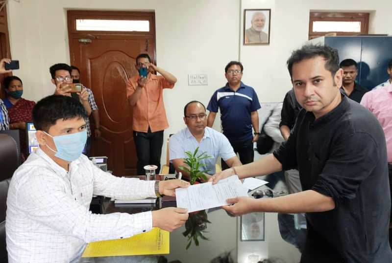 A photo of Pradyot handing over his nomination form to an election official