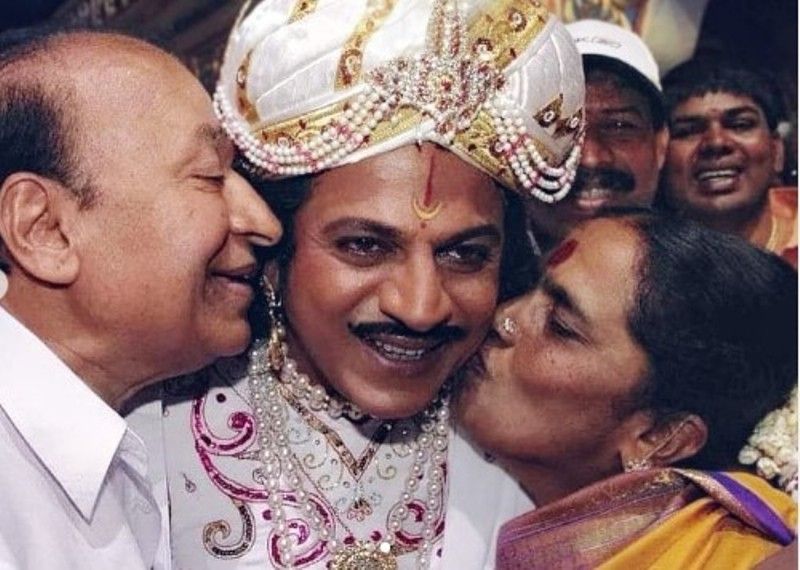 A photograph of Shiva Rajkumar (centre) with his parents