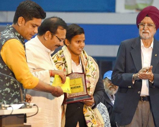Deepti Sharma receiving an award by the Department of Youth Services and Sports Government of West Bengal