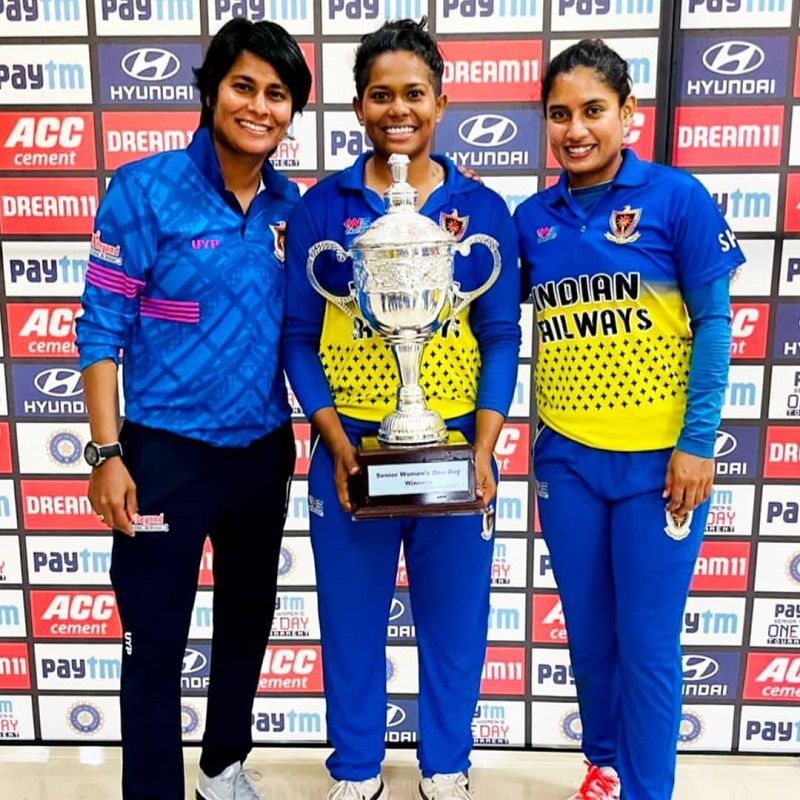 Indrani Roy (centre) holding the Senior Women's One Day Trophy