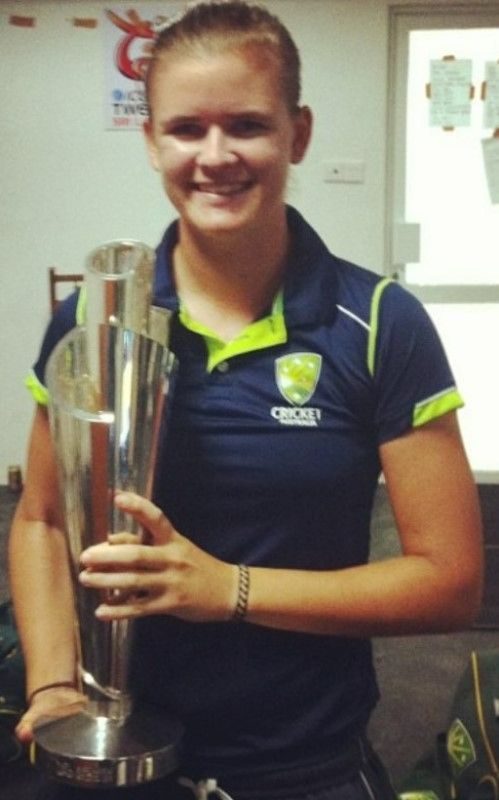 Jess Jonassen with the 2012 ICC T20 World Cup trophy