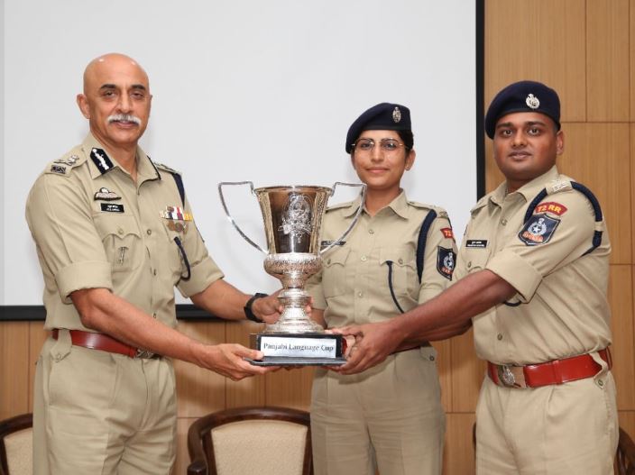 Jyoti Yadav receiving Punjabi Language Corp trophy
