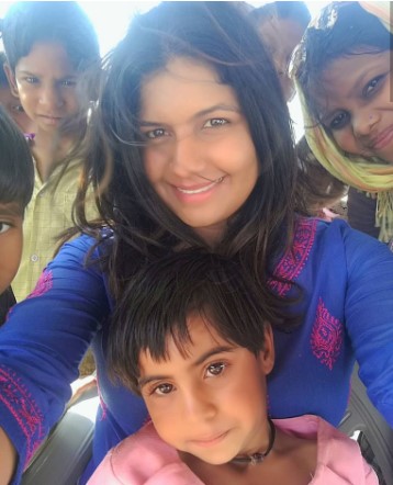 Kartiki Gonsalves taking a selfie with the kids in Turtuk